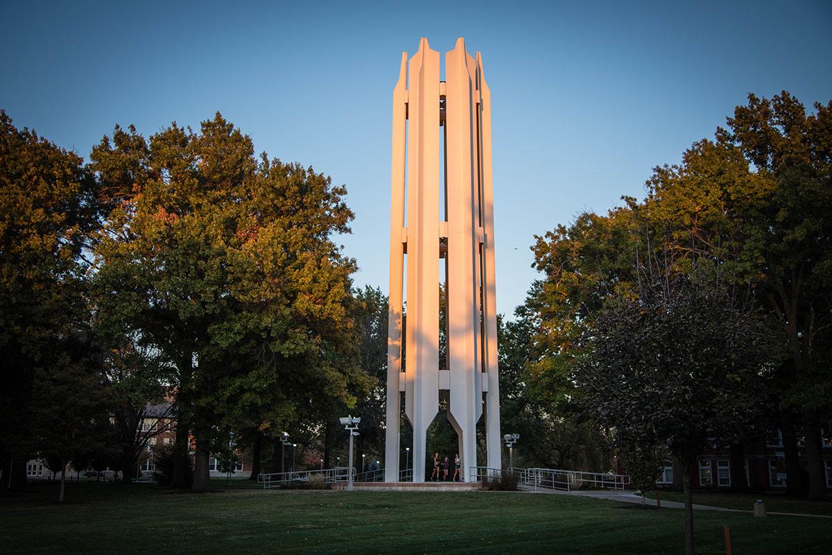 The rising sun bounces off the Memorial Bell Tower on an October morning.